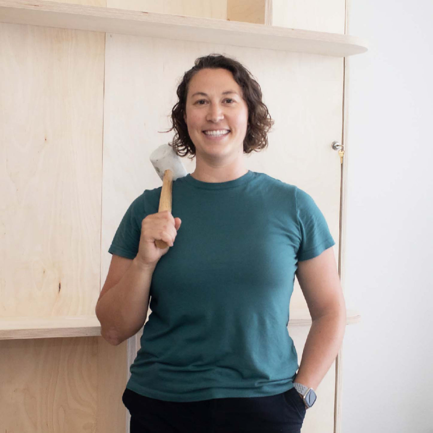 Happy woman after assembling a murphy bed