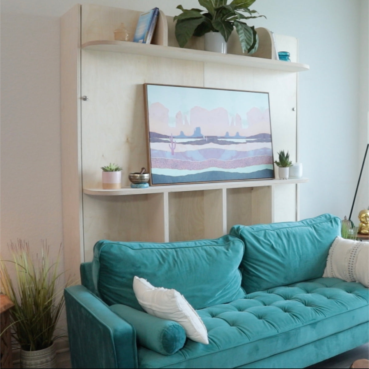 Guest bedroom with a murphy bed and a sofa