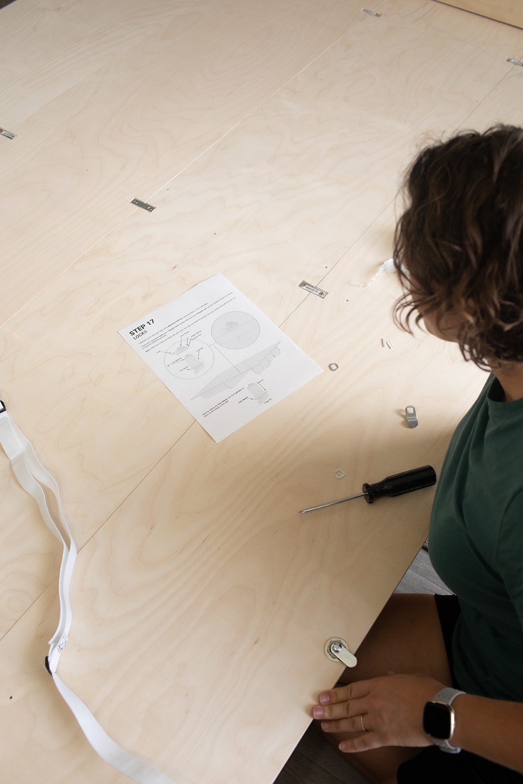 Woman following the steps to build a murphy bed